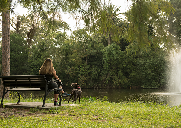 Girl and dog in Audubon Park